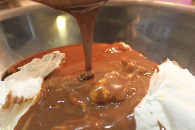 Chocolate sauce poured over whipping cream